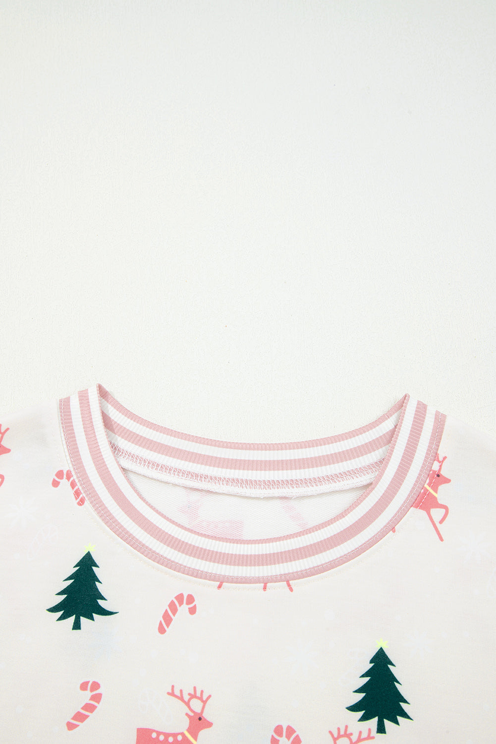 LuckeLadybug LLC Christmas-themed lounge room set featuring reindeer and candy cane patterns