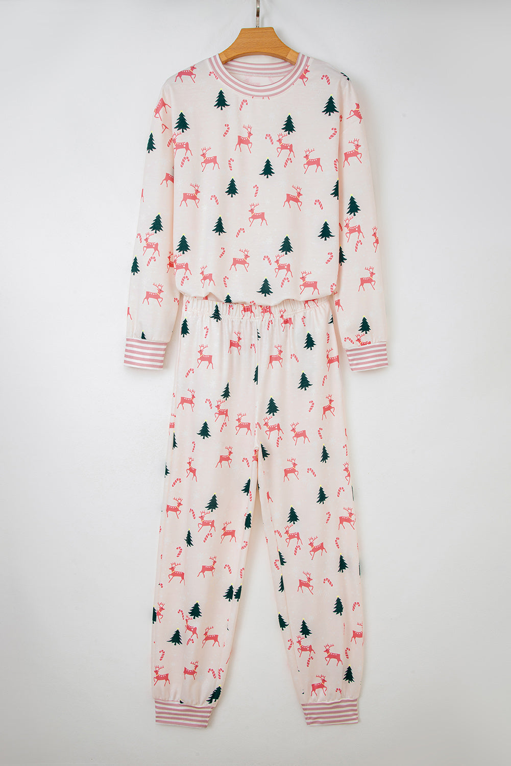 Comfortable pink lounge room set featuring a reindeer and tree pattern, perfect for cozy evenings