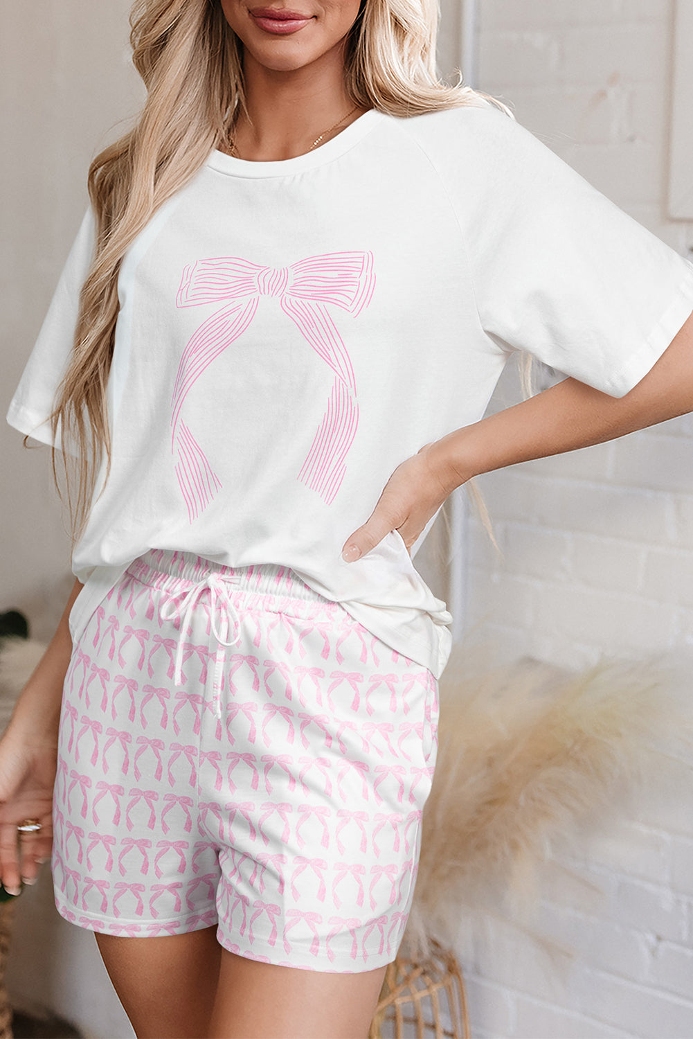 Lounge room set featuring a pink bow graphic tee and matching shorts with a playful pattern