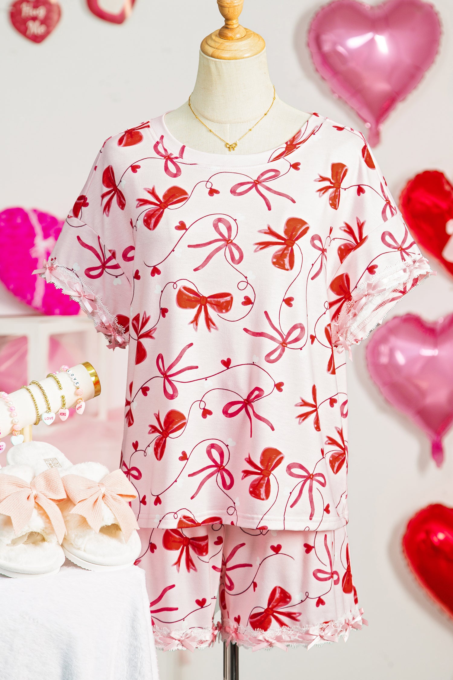 LuckeLadybug loungewear set featuring pink shorts and top with red bow prints for comfortable relaxation
