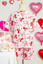 LuckeLadybug LLC loungewear set featuring pink shorts and matching top with bow patterns