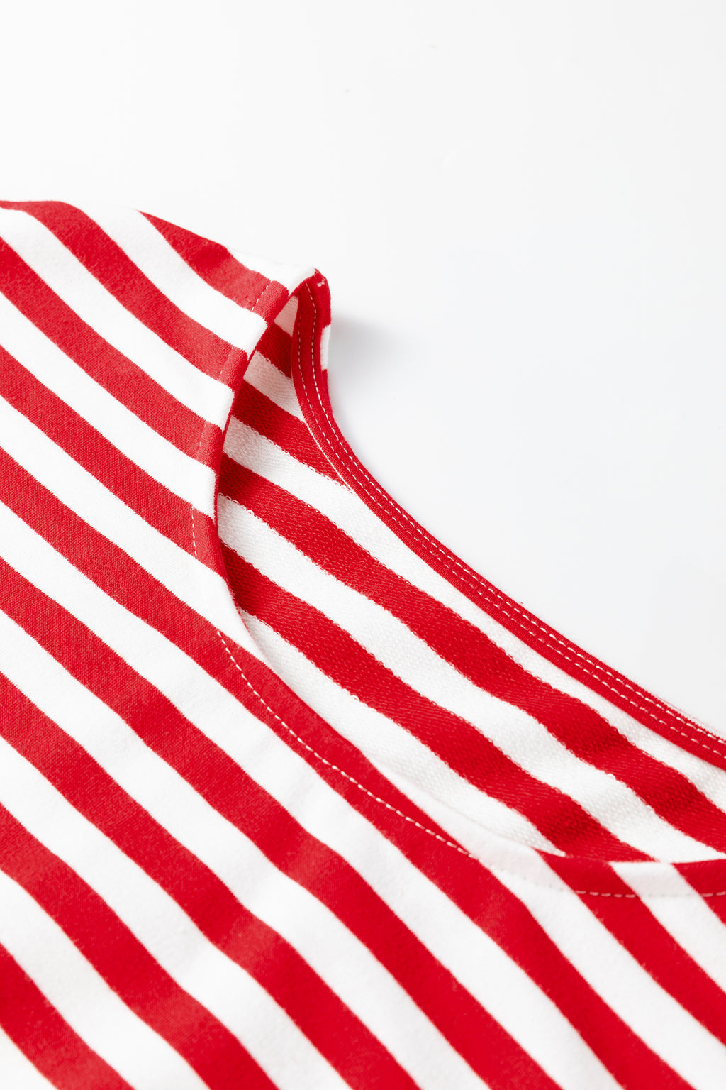 Red and white striped neckline of a loungewear set by LuckeLadybug LLC