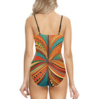Back view of woman wearing abstract print one-piece swimsuit with colorful vibrant pattern