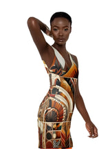African inspired racerback dress with vibrant geometric patterns worn by model