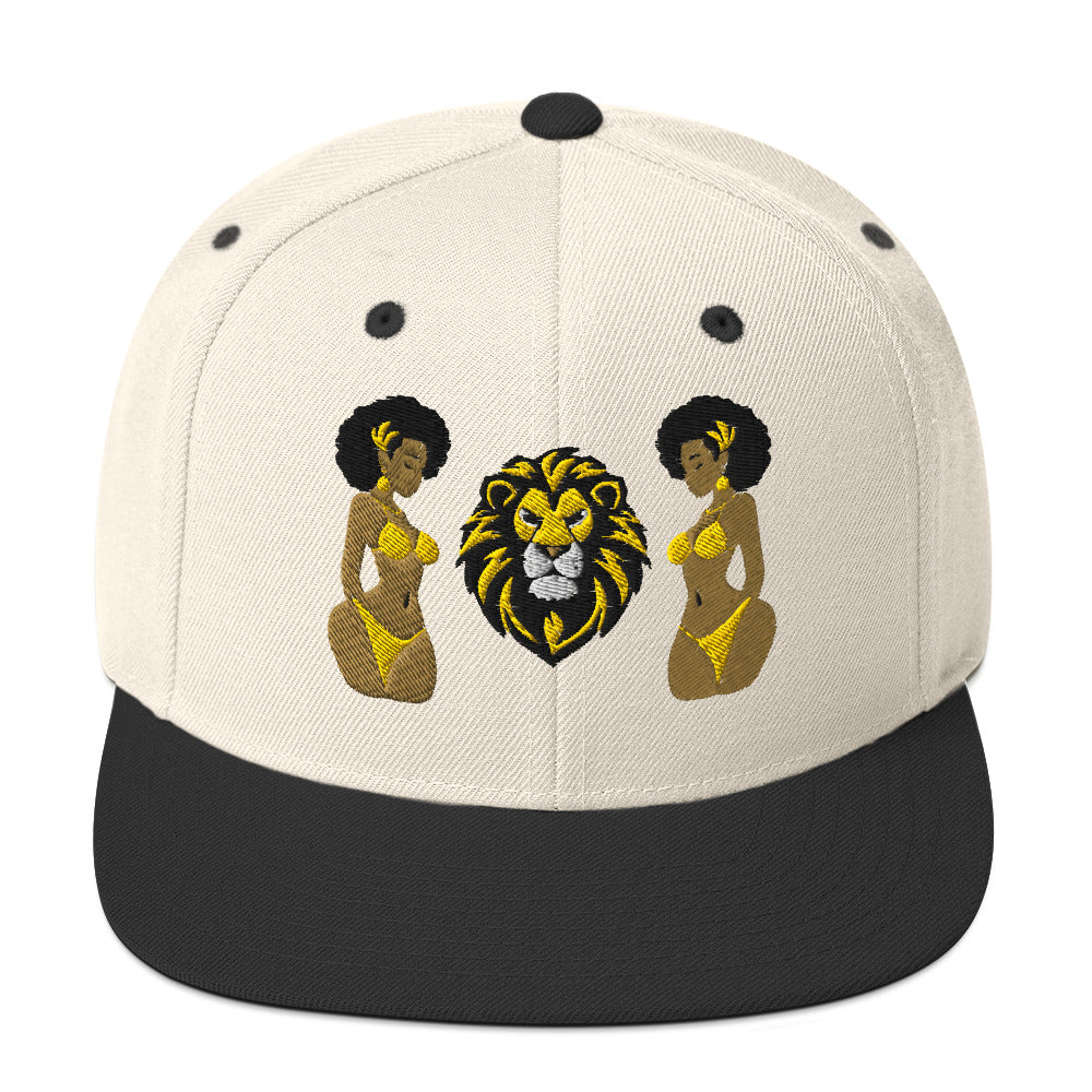 LuckeLadybug African lion snapback hat with embroidered lion face and two women in yellow bikinis