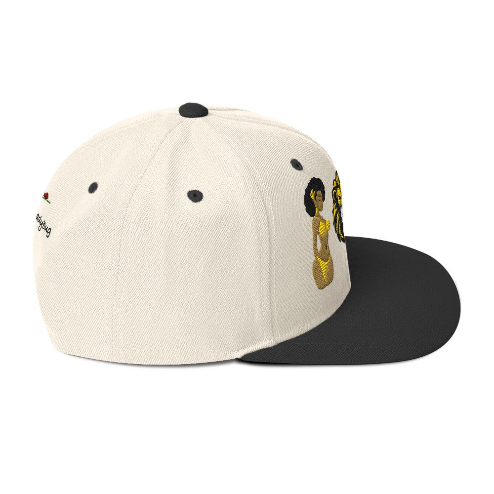 LuckeLadybug African lion snapback hat with beige crown and black flat brim featuring embroidered design