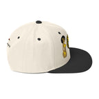 LuckeLadybug African lion snapback hat with beige crown and black flat brim featuring embroidered design