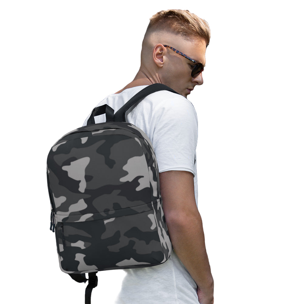 LuckeLadybug Black Camo Design Backpack For Everyday Use on young man wearing sunglasses and white tee