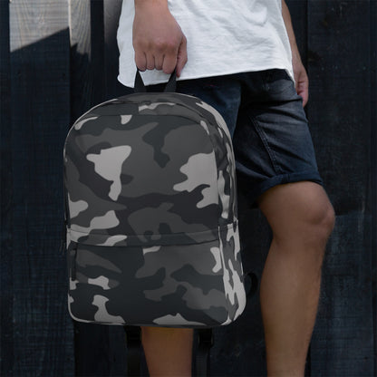 LuckeLadybug Black Camo Design Backpack For Everyday Use. Gray and black camo backpack held by person at side