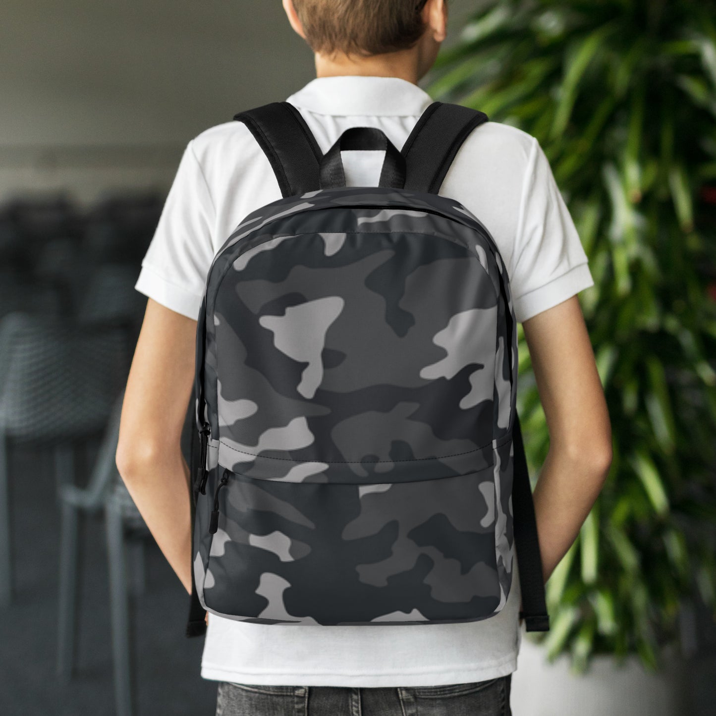 LuckeLadybug Black Camo Design Backpack For Everyday Use worn by student with padded straps and front zip pocket