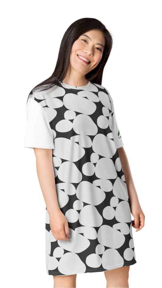 Luckeladybug chic black and white t-shirt dress with bold abstract pattern worn by smiling woman