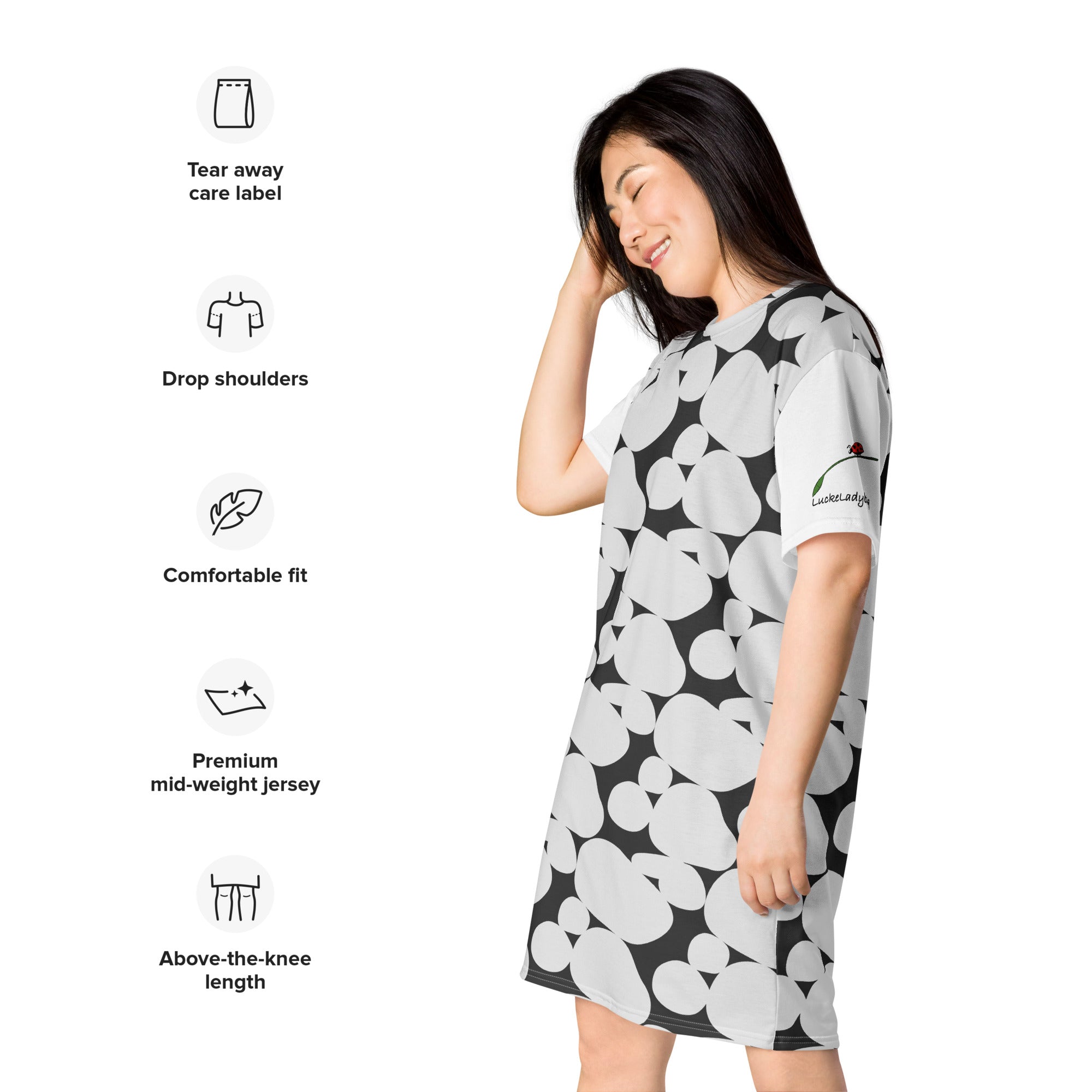 woman wearing chic black and white t-shirt dress with drop shoulders and above-the-knee length