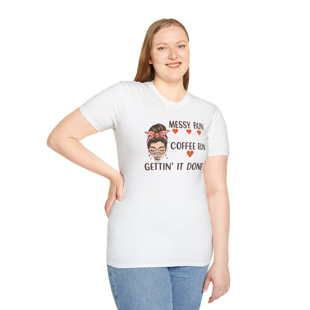 Coffee mom graphic tee in white with humorous messy bun and coffee run design worn by smiling woman