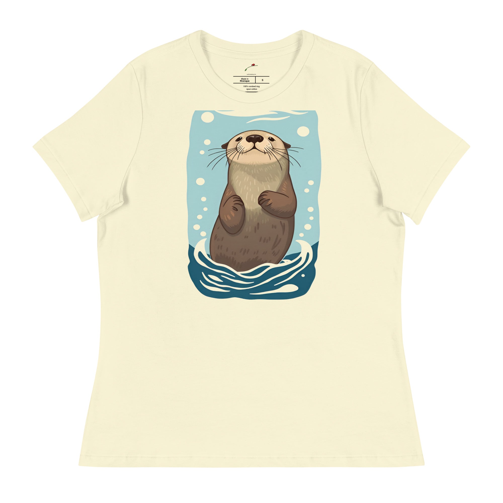 cream t-shirt featuring a cute sea otter graphic tshirt design with blue water and bubbles