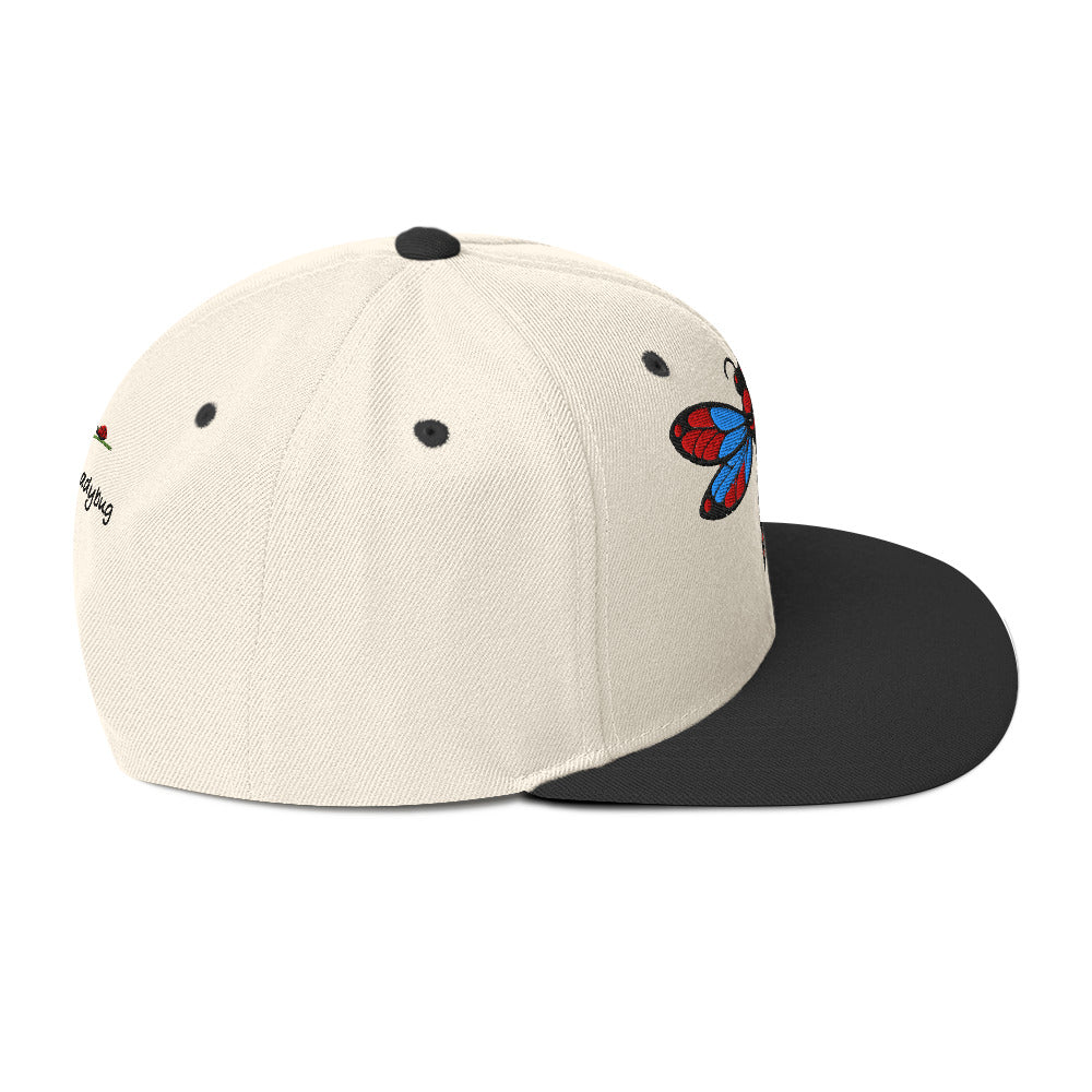 LuckeLadybug dragonfly snapback hat with cream crown and black flat brim featuring embroidered colorful dragonfly design