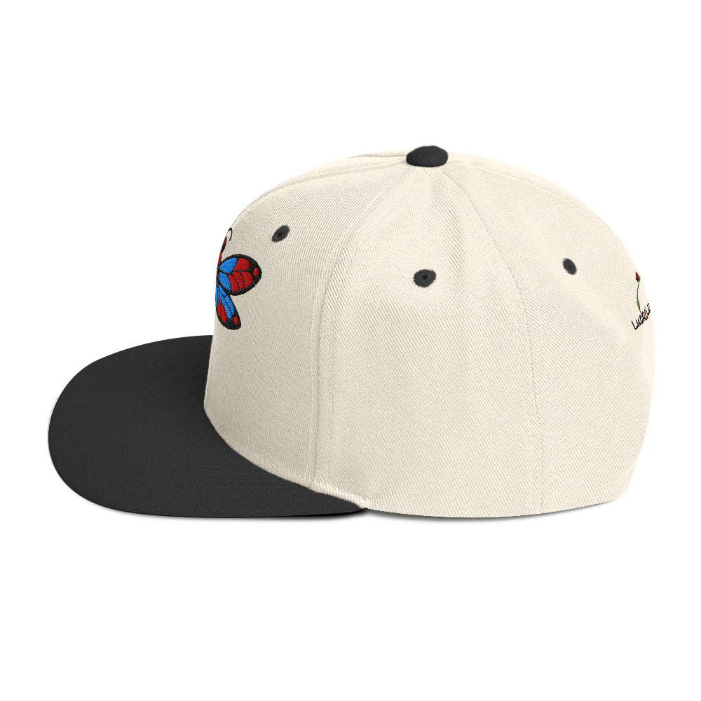 LuckeLadybug dragonfly snapback hat with cream crown and black flat brim featuring colorful dragonfly embroidery
