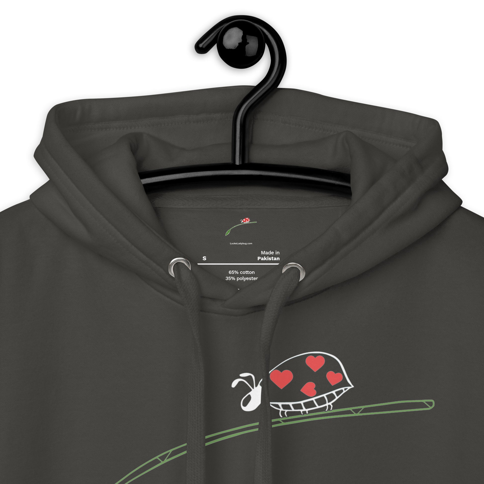 fashion-forward men's hoodie in dark color with heart-themed graphic on front