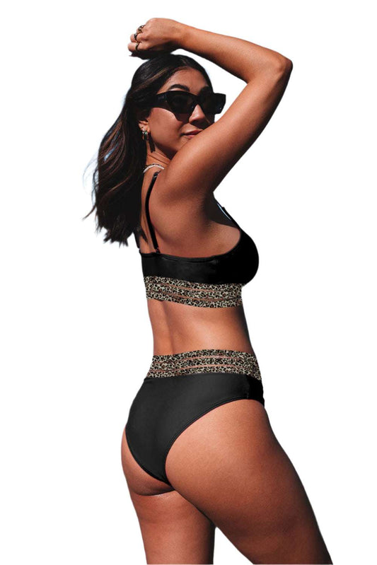 Woman wearing fashion forward swimwear for women black bikini with leopard print bands