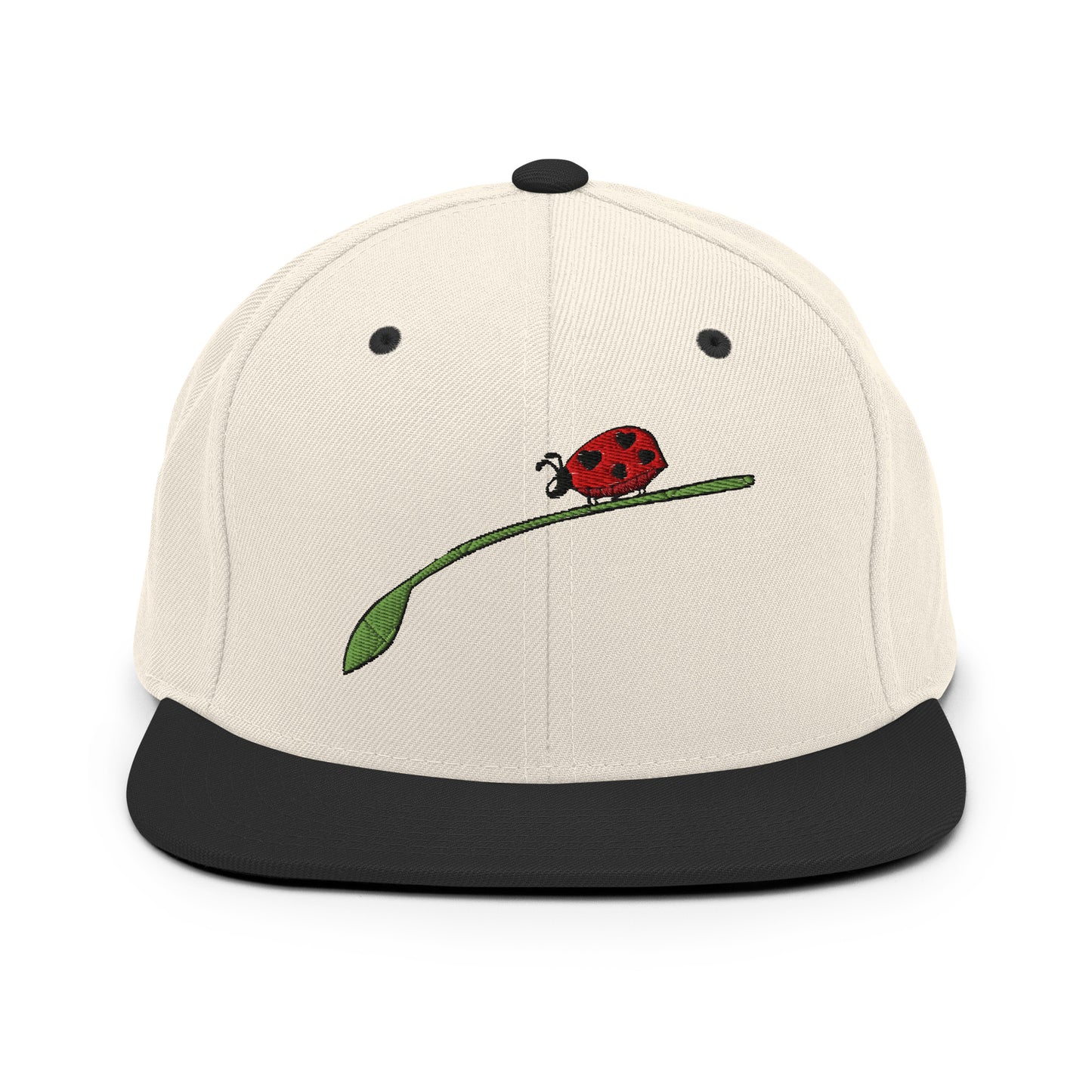 LuckeLadybug fashion snapback for men in beige with black brim featuring embroidered ladybug on green leaf