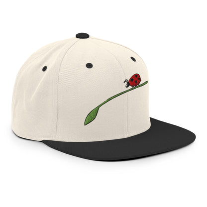 LuckeLadybug fashion snapback for men with beige crown black brim and embroidered ladybug design