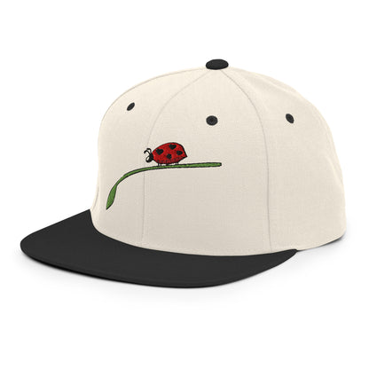 LuckeLadybug fashion snapback for men with beige crown black flat brim and embroidered ladybug design