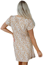 Back view of woman wearing LuckeLadybug khaki abstract print dress T-shirt dress with short sleeves