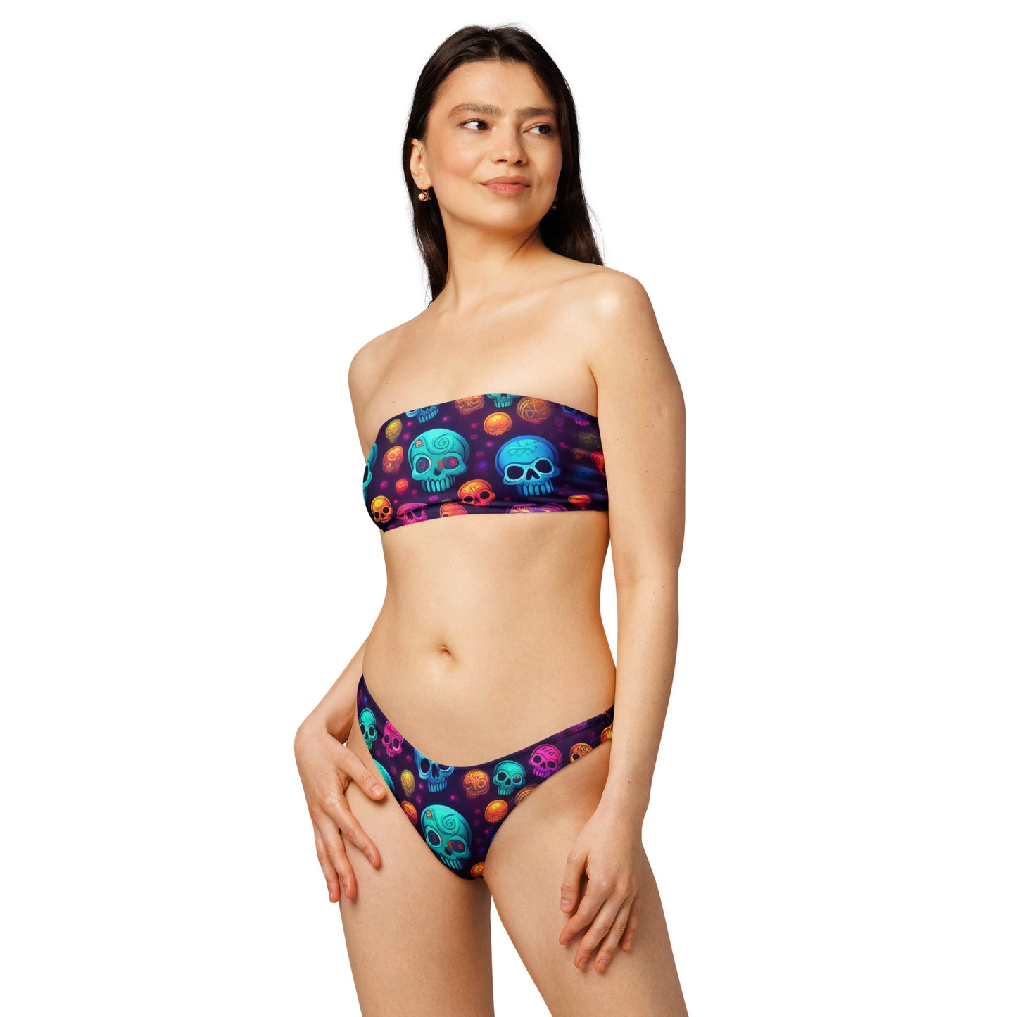 LuckeLadybug neon skull bikini with colorful skull prints worn by woman with strapless top and matching bottoms