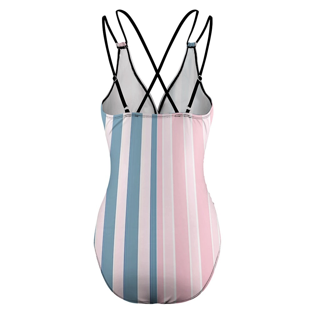 Back view of pink striped one piece swimsuit with blue and pink vertical stripes and black adjustable straps