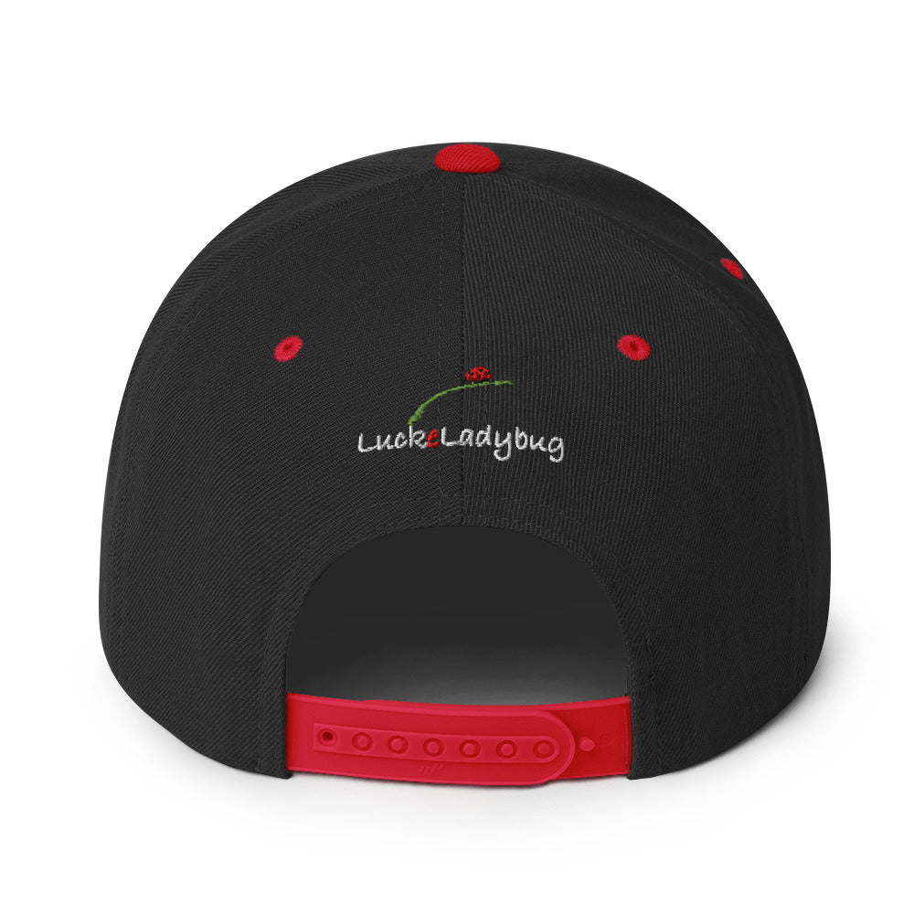 Back view of LuckeLadybug pizza monster snapback hat in black with red adjustable strap and embroidered logo