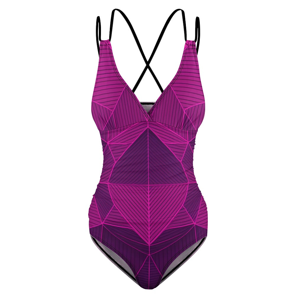 Purple abstract one-piece swimsuit with geometric pattern and black crisscross straps by luckeladybug