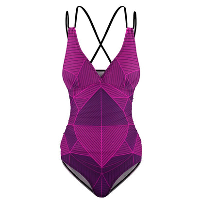 Purple abstract one-piece swimsuit with geometric pattern and black crisscross straps by luckeladybug