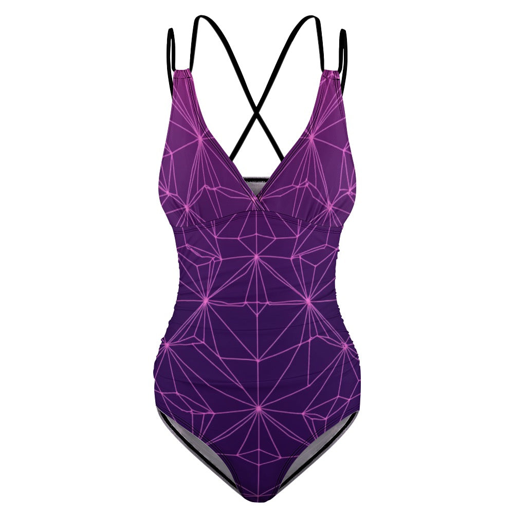 Purple abstract one-piece swimsuit with geometric pattern and crisscross back straps