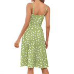 Back view of sage green suspender dress with white abstract print and adjustable straps