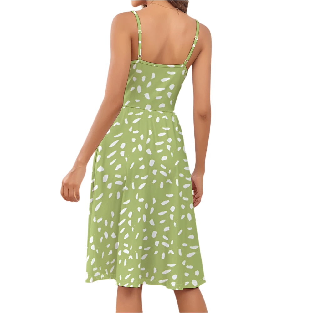 Back view of sage green suspender dress with white abstract print and adjustable straps