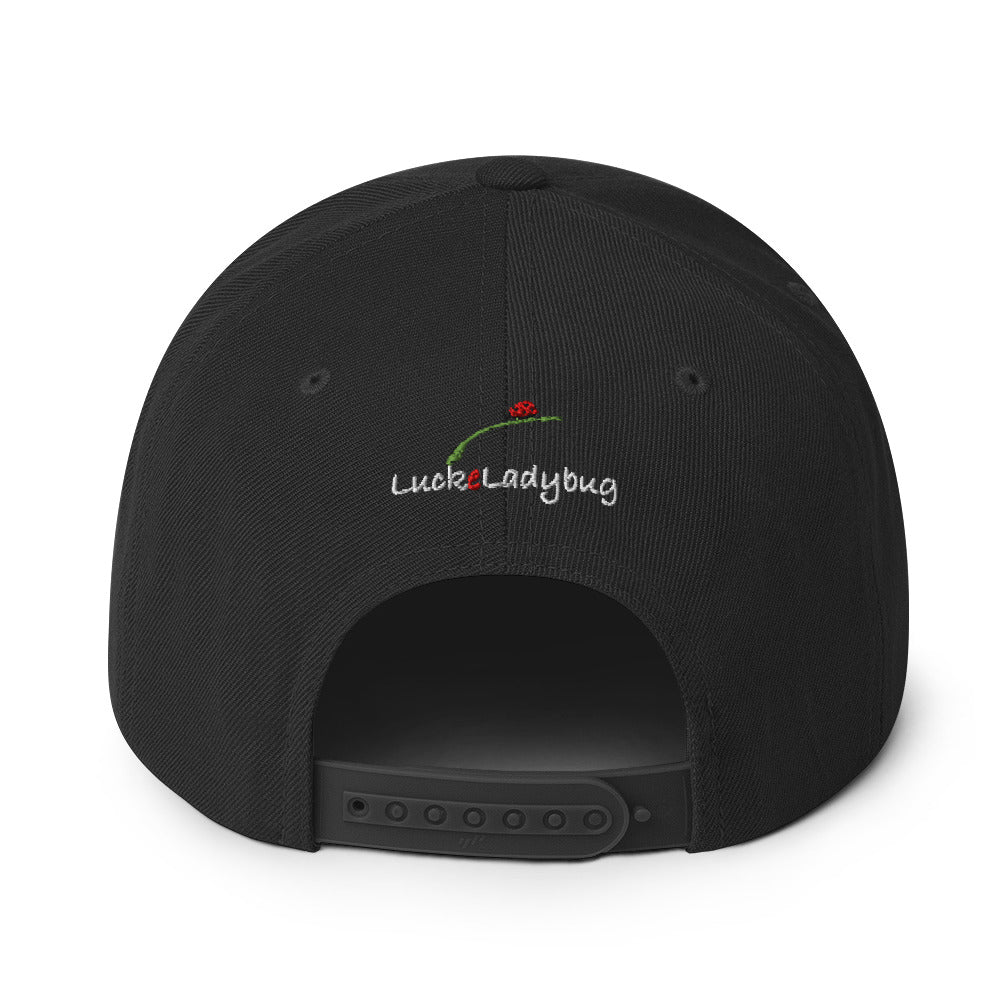 Back view of black LuckeLadybug snapback hat with adjustable strap and logo embroidery