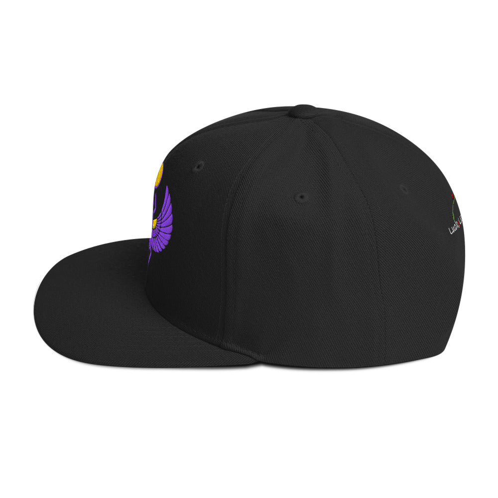 Black snapback hat by LuckeLadybug featuring a colorful scarab embroidered cap design on front