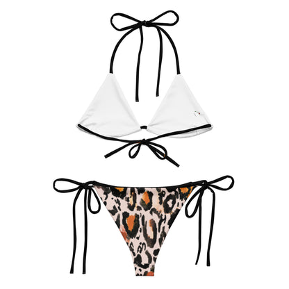 bikini set featuring white top and sexy animal print swimwear bottom with black tie straps