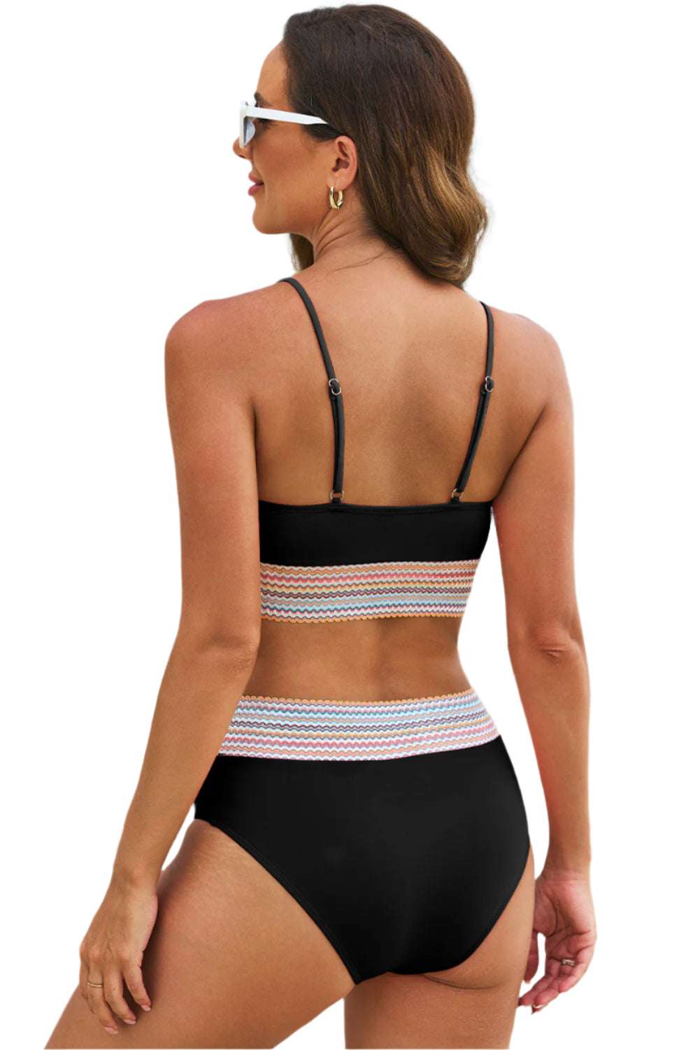Back view of a black striped patchwork swimsuit for women with adjustable straps from LuckeLadybug LLC