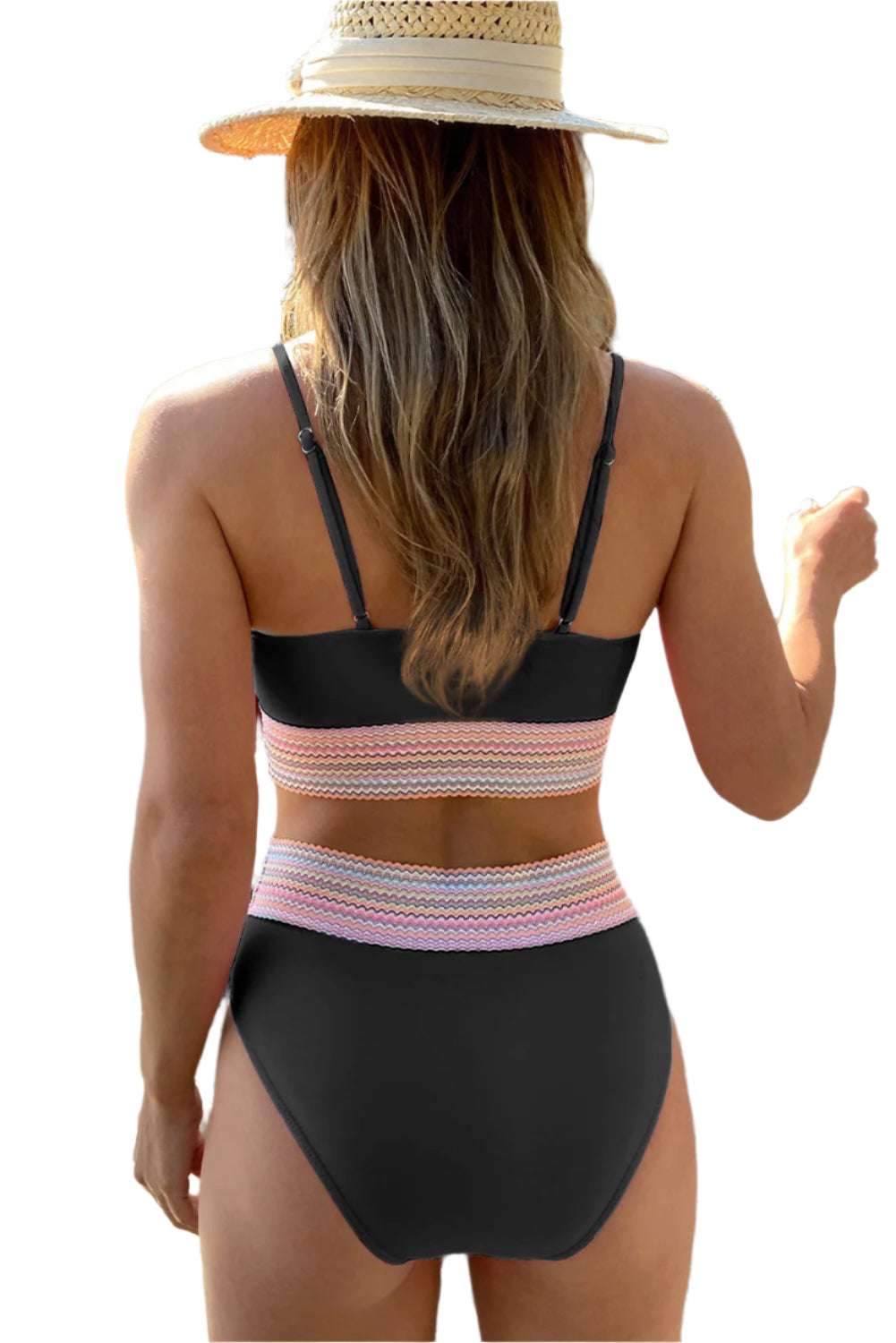 Back view of woman wearing LuckeLadybug LLC striped patchwork swimsuit for women with black and multicolor bands