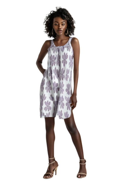 summer floral beach dress with purple flower print worn by model with heels