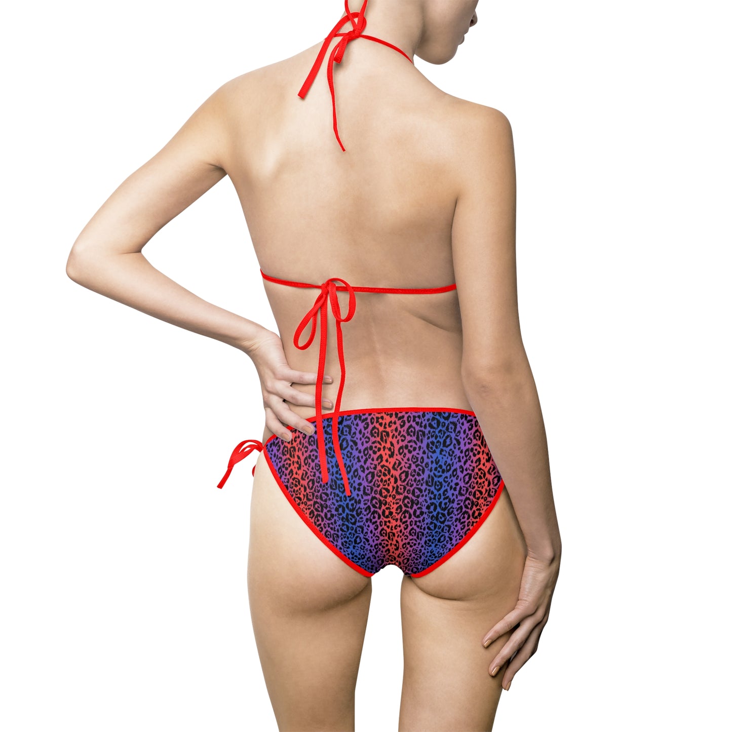 Back view of a model wearing a vibrant women's bikini swimsuit with red trim and multicolor leopard print