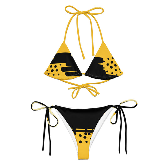 yellow black abstract bikini with triangle top and tie-side bottoms in bold graphic design