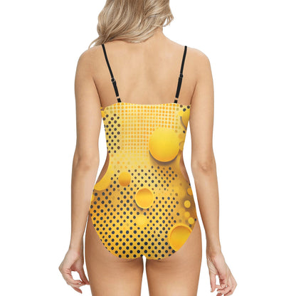 Back view of yellow polka dot swimsuit with black adjustable straps on a woman