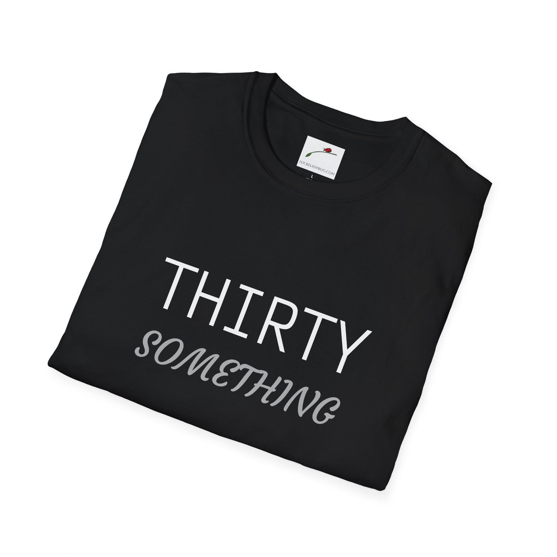 Black LuckeLadybug thirty something t shirt with white and gray text folded neatly