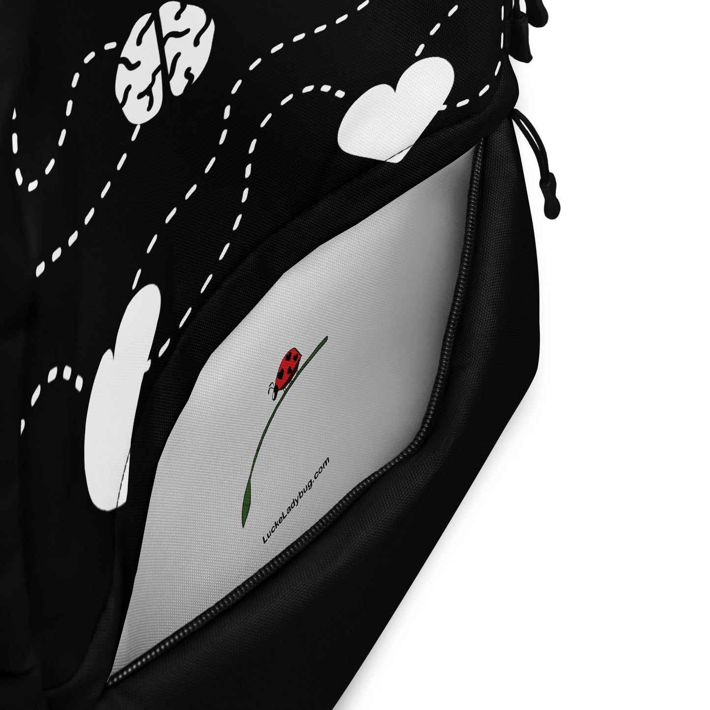 LuckeLadybug Black Backpack With White Hearts with front zip pocket open showing white interior and ladybug logo