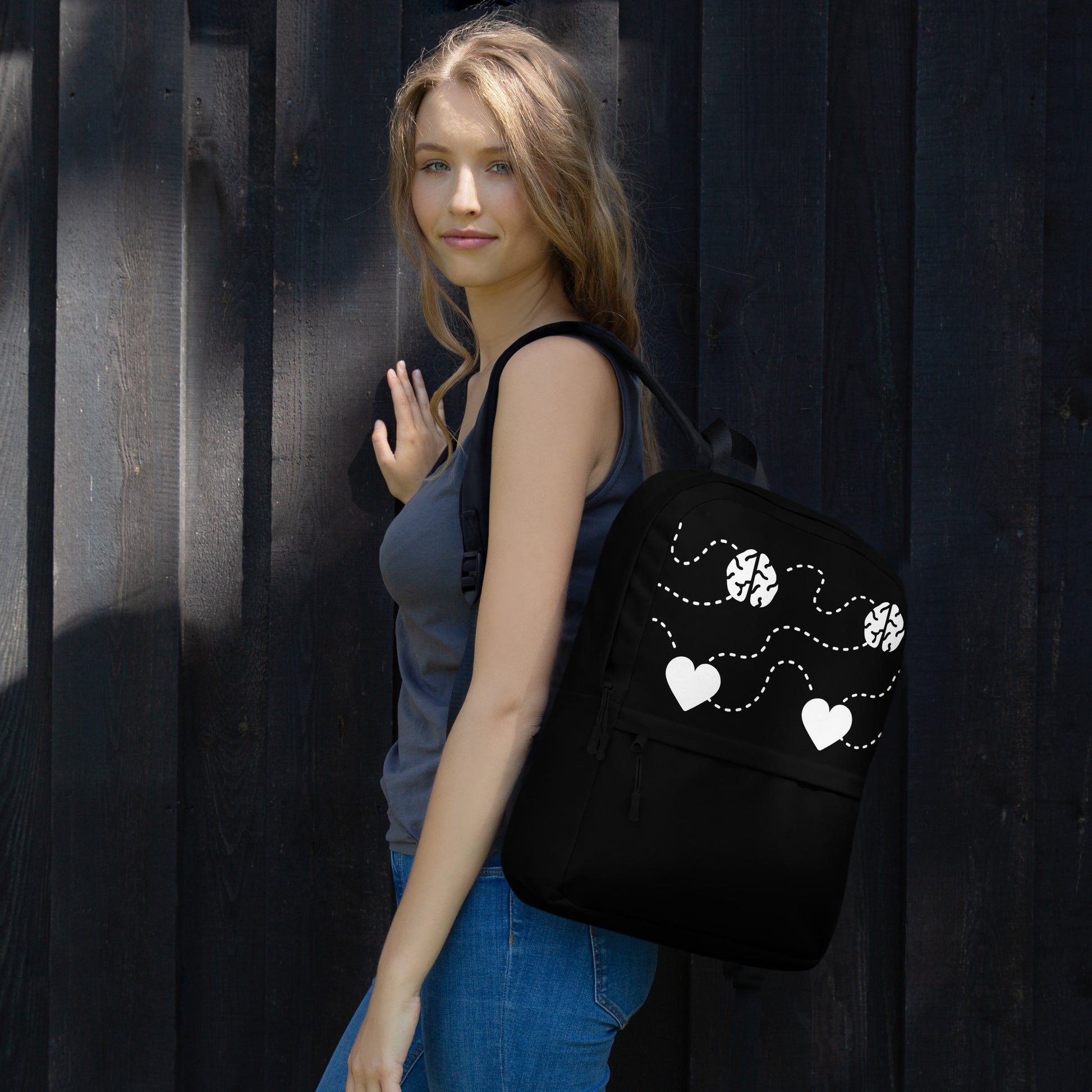 Black Backpack With White Hearts worn by woman over shoulder LuckeLadybug stylish casual daypack