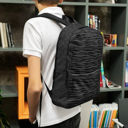 LuckeLadybug black striped backpack worn by student with padded straps and spacious main compartment
