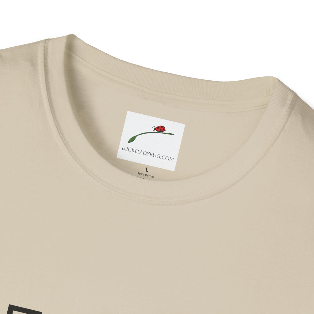 Close-up of LuckeLadybug beige cotton fifty something t shirt collar and label