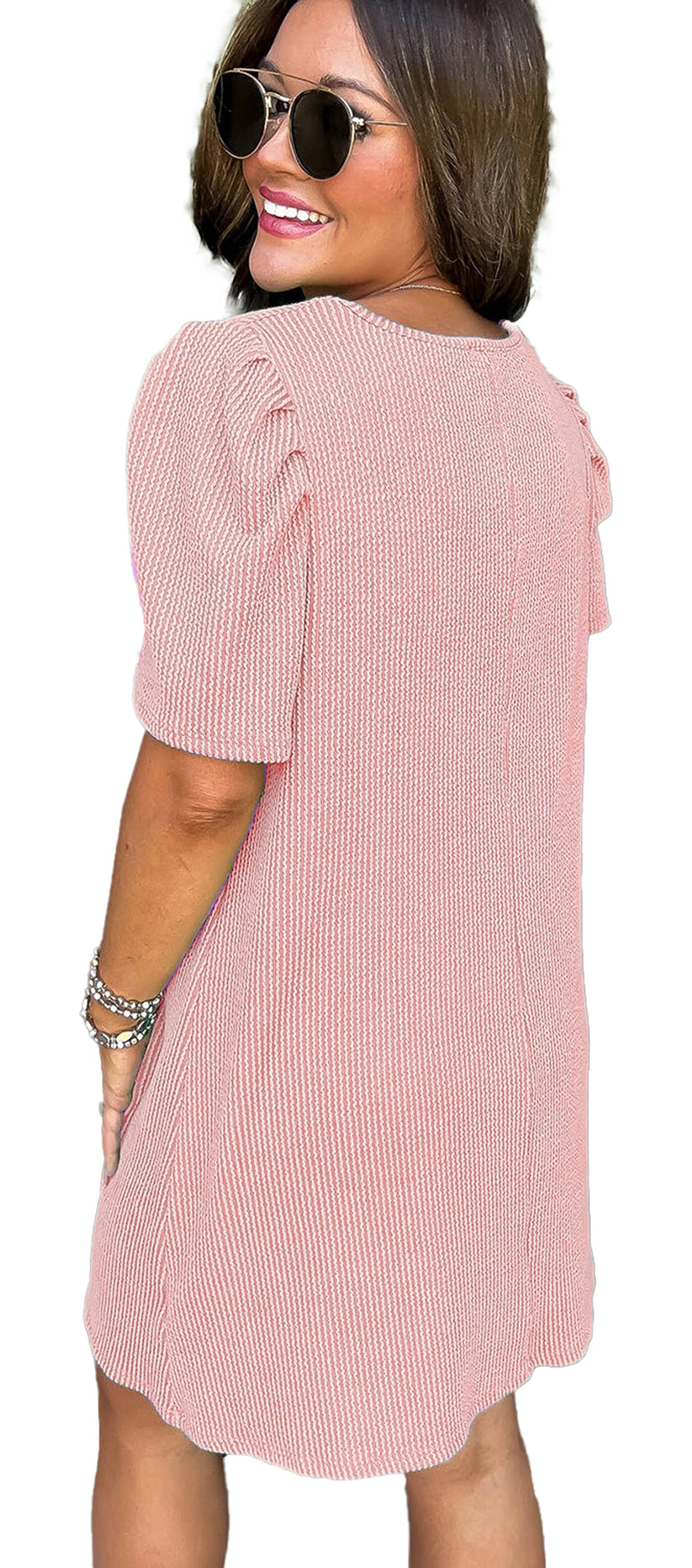 LuckeLadybug parchment knit mini dress back view on smiling model with puff sleeves and sunglasses