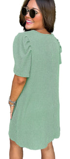 Woman model wearing LuckeLadybug parchment knit mini dress in sage green H Line ribbed knit with puff sleeves